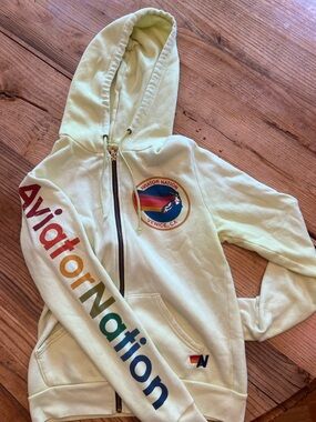Aviator Nation Womens Light Yellow Zip Hoodie with Rainbow Sleeve Logo